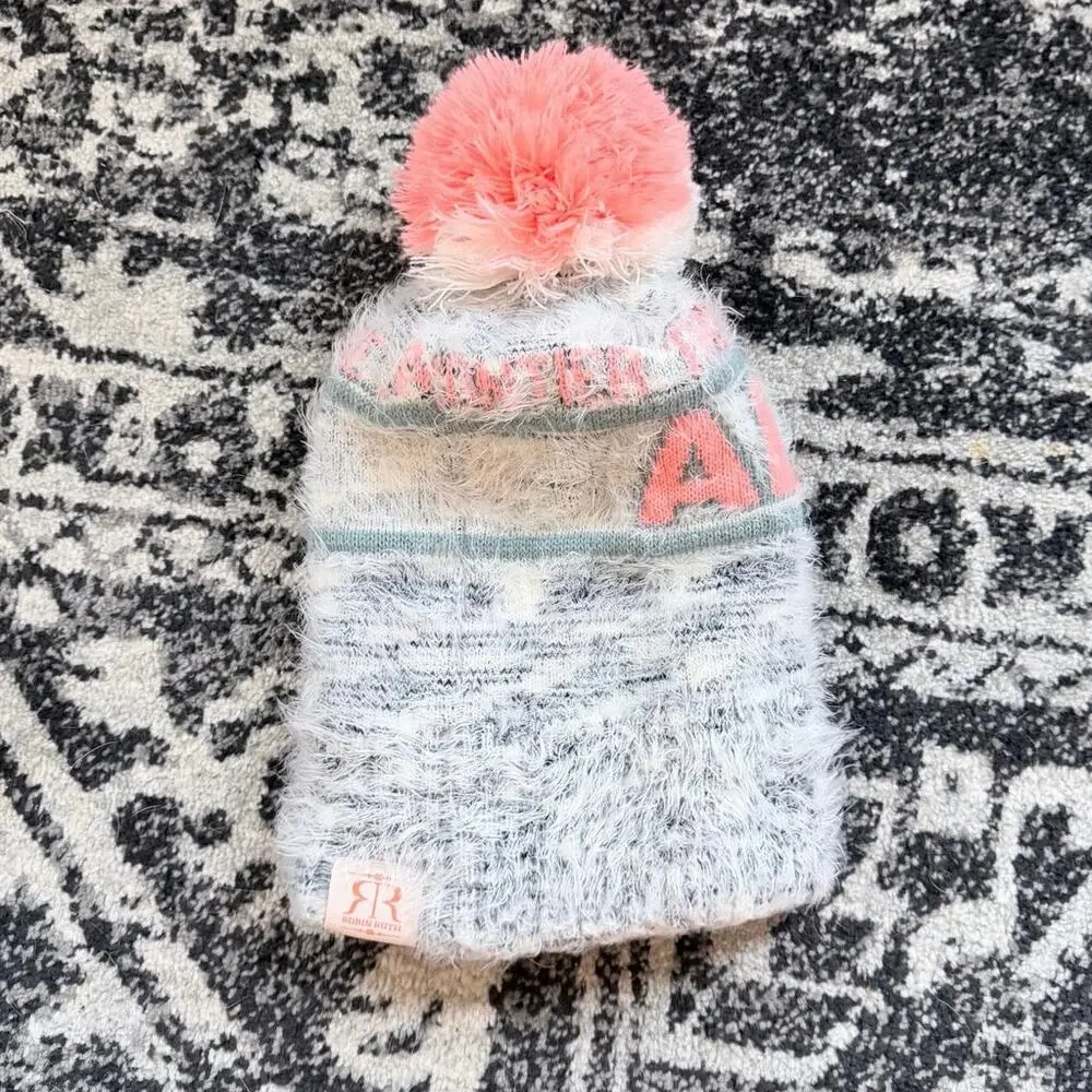 Robin Ruth Alaska heavy weight knit beanie hat with a variegated pink pom pom